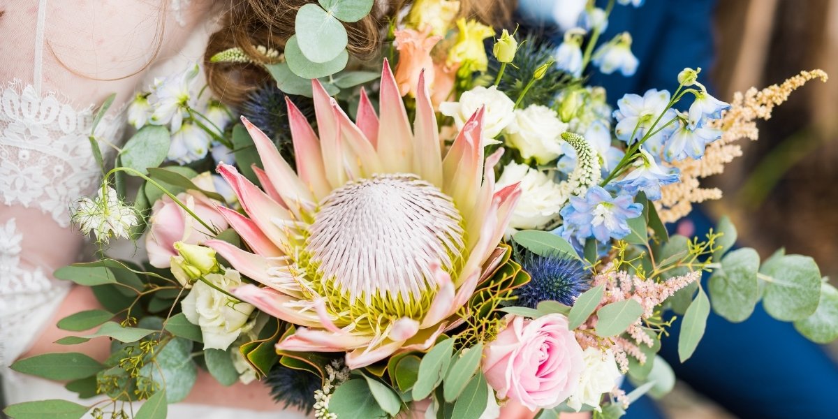The difference when having real bouquet and fake centerpieces?